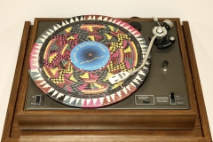 Fatimah Tuggar, Fai-Fain Gramophone, 2010 Record player, raffia disks with labels, music by Barmani Choge, entertainment center 53 x 32 1/2 x 24 in. (134.6 x 82.5 x 70 cm) Artwork Credit: Courtesy of Fatimah Tuggar and BintaZarah Studios