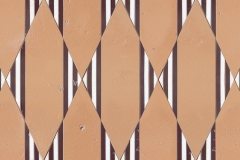 Nezbah, a waterjet stone mosaic, shown in polished Cloud Nine with Tulip and Snapdragon Glazed Basalto.