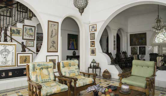 A series of dynamic arches define the spaces of this 1930s living room in Miramar, which is a traditional Mediterranean-style house on the outside.