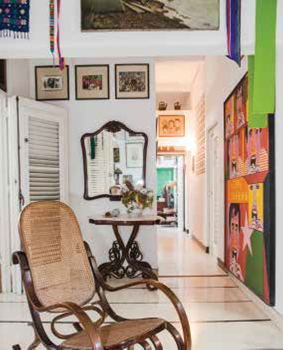 In the front hall, a bentwood rocking chair and console table bear witness to the many European imports that have been staples of Havana’s eclectic interiors.