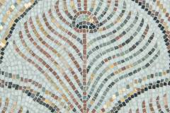 Calamus, a hand-chopped stone mosaic, shown in tumbled Calacatta Monet, Nero Marquina, Cavern, Blue Bahia, Blue Macauba, Emperador Dark, Red Lake, Aegean Brown, Rojo Alicante, Red Travertine,  Giallo, Persian Gold, Desert Pink, Crema Valencia, Rose Pearl, Verde Luna, and Kay's Green, polished Aurum, is part of the Heritage Collection by New Ravenna.