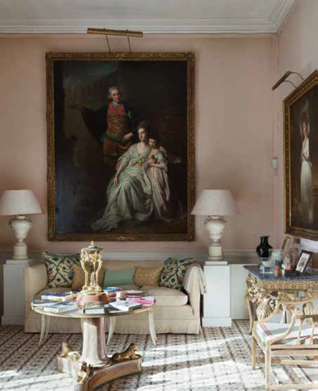 A George Romney painting—the one that made his career, in fact. This went away on tour a few years ago, and my father brought in a photographic copy with the same dimensions. Below the painting are Chinese vases that my father transformed into table lamps.