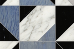 Axel Grand, a hand-cut stone mosaic,shown in polished Calacatta Tia, Nero Marquina, and Blue Macauba, is part of the Semplice™ collection for New Ravenna.