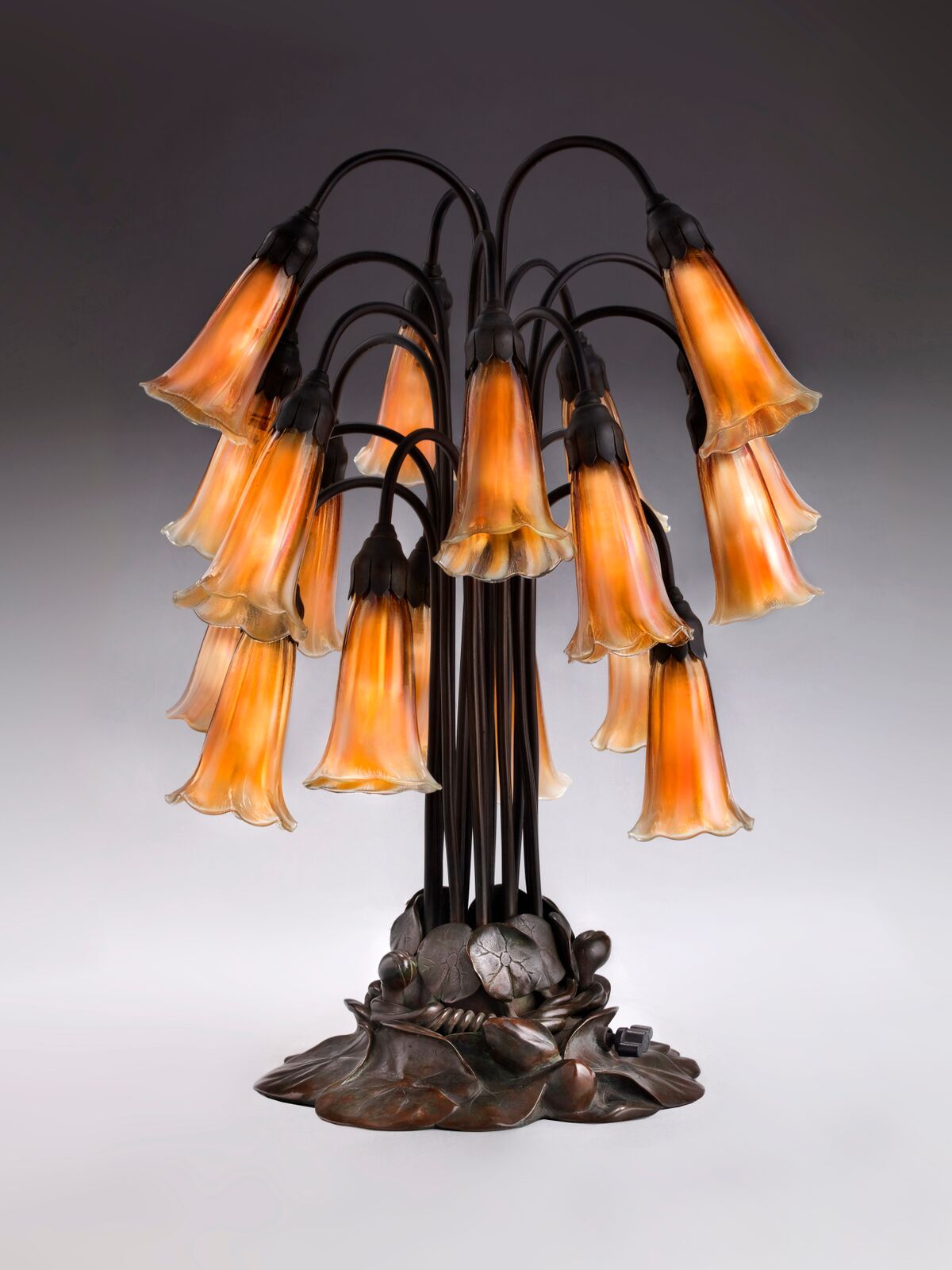 Tiffany Glass & Decorating Company, Eighteen-Light Lily Table Lamp , prior to 1902, bronze, blown glass. Photograph by John Faier. © 2013 Driehaus Museum
