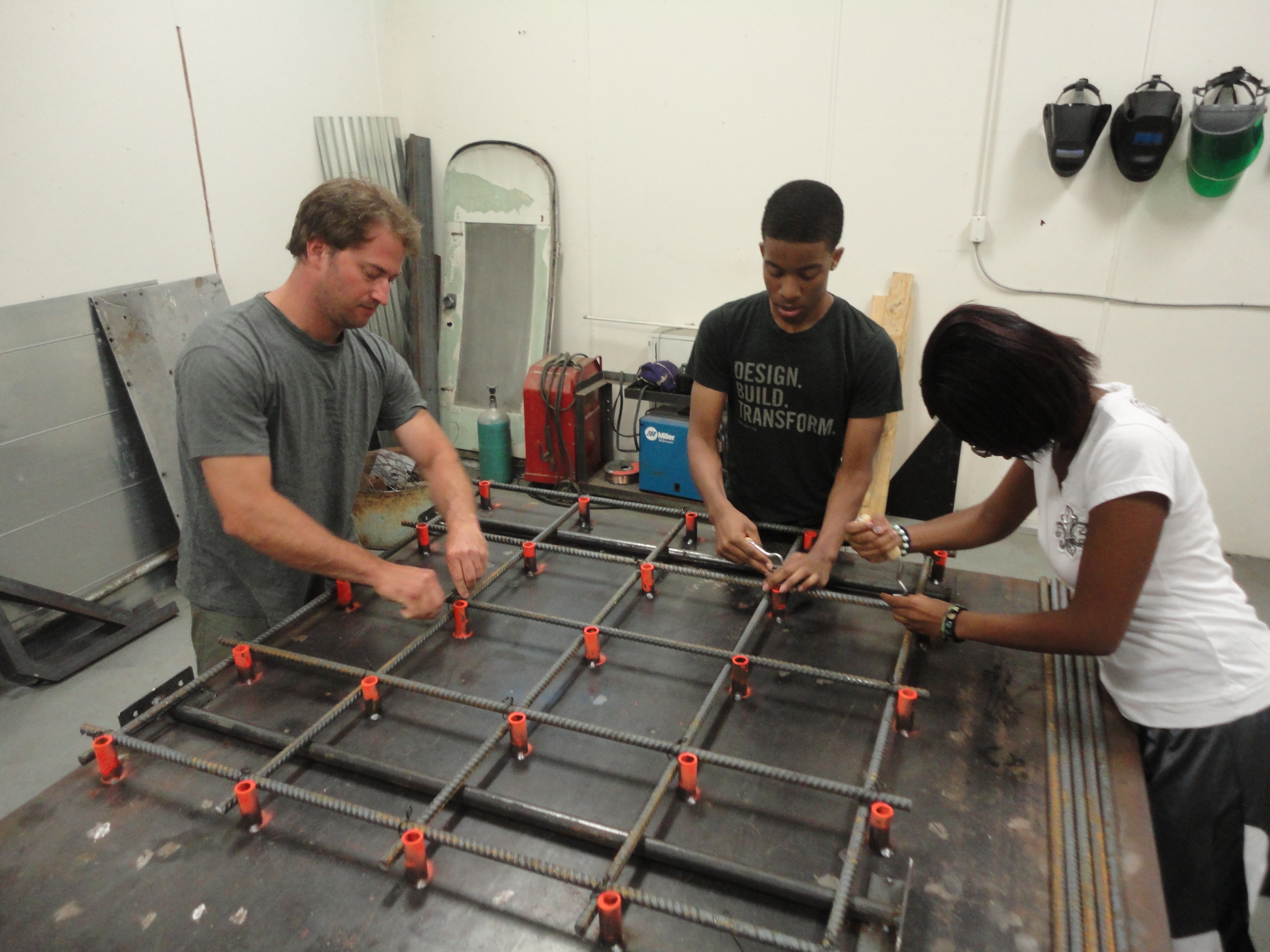 6-studio-h-volunteer-eric-wandmacher-and-studio-h-students-kerron-hayes-and-alexia-williams-construct-a-portion-of-the-base-for-the-windsor-farmers-market-pavilion-from-if-you-build-it-a-long-shot-fa